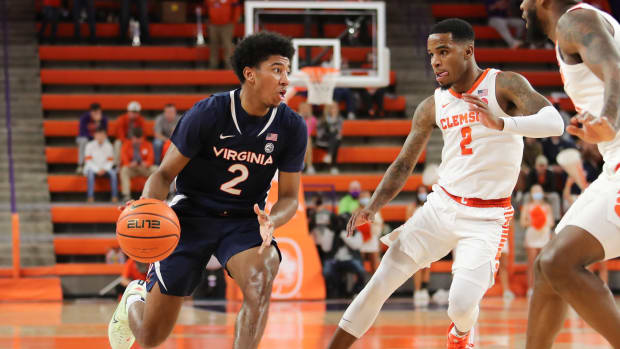 Virginia Cavaliers guard Reece Beekman (2) controls the ball as Clemson Tigers guard Al-Amir Dawes (2) defends during the first half at Littlejohn Coliseum.